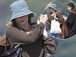 Margot Robbie keeps a low-profile in a bucket hat as she enjoys a luxury day out with pal Phoebe Tonkin at celebrity hotspot Club 55 in Saint-Tropez