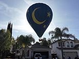 Homeowners’ shock as hot air balloon makes emergency crash landing in their backyard