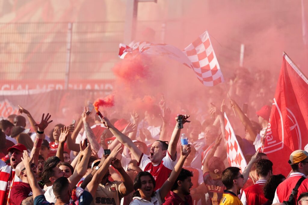 In pictures: Arsenal fans celebrate Premier League title as thousands flock to Emirates Stadium
