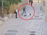 Shocking moment nun is pushed over and repeatedly kicked in Jerusalem, amid claims of a rise in attacks targeting Christians