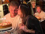 Victoria Beckham plants a kiss on husband David’s cheek as he kicks off his 51st birthday celebrations with a lavish meal at The Dorchester