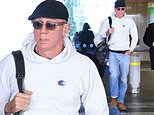 Daniel Craig tries to keep a low profile in a hat and sunglasses as he touches down in Greece amid filming for new prison drama