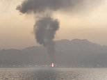 Trump unleashes midnight strikes on crucial Iran oil port as officials frantically insist ceasefire is holding