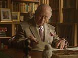 First class! Sir David Attenborough gets a surprise centenary message from King Charles and Queen Camilla – delivered with help from royal pooch