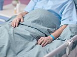 Husband whose wife cut off his penis when he invited a second woman to live with them sues after images of his genitals in a medical bag are leaked