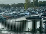 That won’t help the post-holiday blues! Dozens of cars parked at Heathrow Airport are submerged by floodwaters