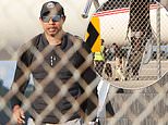 Tiger Woods seen for the first time since DUI arrest as he returns from Swiss rehab with beloved dogs by his side