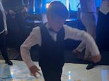 Adonis Fury, 7, tears up the dance floor as he shows off his funky moves at his sister Venezuela’s wedding
