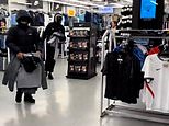 Moment hooded youths ransack JD Sports store – before female workers battle to reclaim clothes