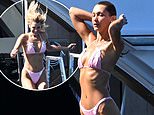 Bella Hadid shows off her supermodel figure in a pink bikini as she cools off on a luxury yacht while taking a break from the Cannes Film Festival