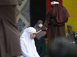 Woman passes out after couple are lashed 100 times for having sex outside marriage under Indonesian province’s Sharia law