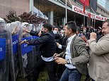 Turkish riot police storm opposition party’s headquarters to oust its leader: Dramatic photos show tear gas billowing and barricades being demolished