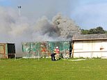 ‘Screaming’ boy, 11, saved by heroic group of fathers after he was trapped in burning storage container – as teen, 13, is arrested over ‘attempted murder’