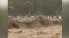 Moment Indonesian river overflows from heavy rain