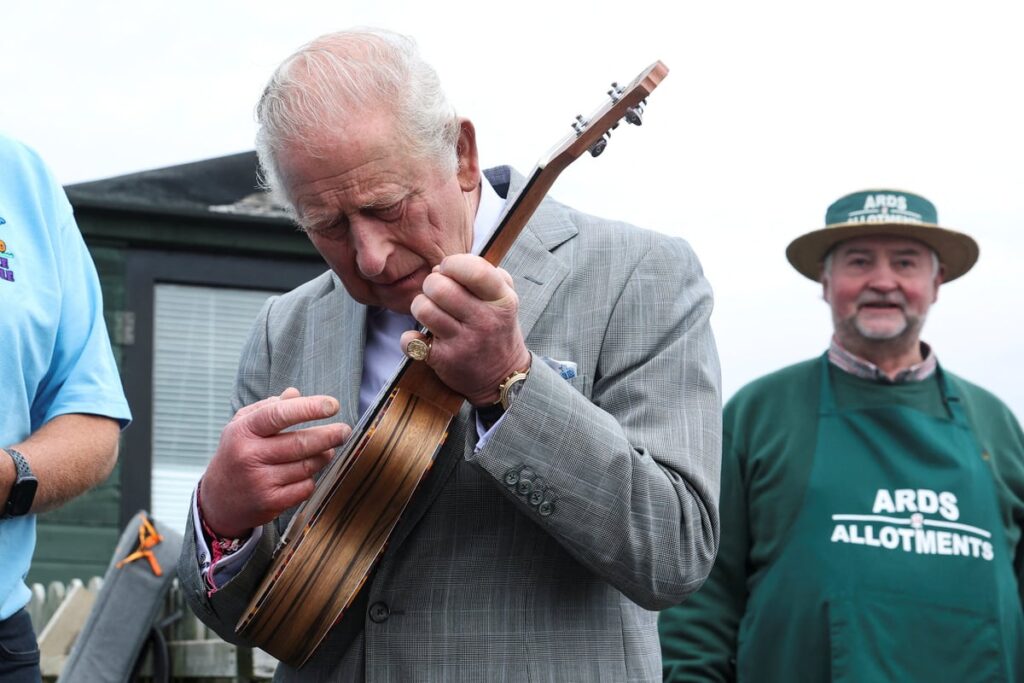 Charles shows plenty of pluck as he picks up ukulele on Northern Ireland visit