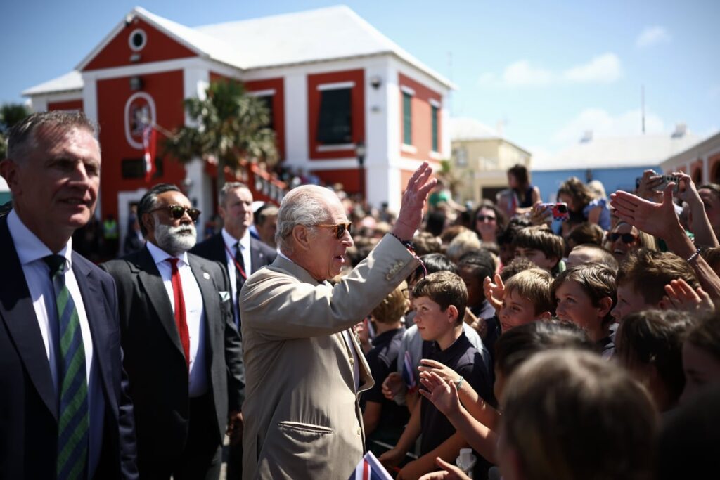 Hundreds of school children and islanders welcome the King to Bermuda