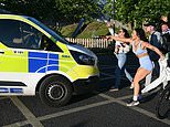 Eleven officers and police dog hurt in Henry Nowak clashes as police race bias rules are blamed for handcuffing of dying white student that sparked fury