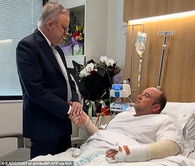Bondi shooting hero Ahmed Al Ahmed (pictured shaking hands with Prime Minister Anthony Albanese) has been charged with assault