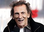 Paint it black! Rolling Stones icon Ronnie Wood is ordered to replace bright pink door on his £7million west London mansion by jobsworth council