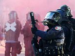 Police tear gas protesters who set fire to a Tesla and smashed United Nations office’s windows in Geneva ahead of G7 summit