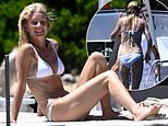 Gwyneth Paltrow, 53, shows off her incredible figure in a white bikini as she kicks back on a luxury yacht in Sardinia with shirtless  Brad Falchuk after their ‘heated arguments’ were revealed