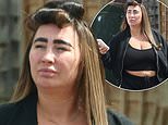 TOWIE’s Lauren Goodger sports a crop top as she steps out with her hair in rollers after a spot of pampering