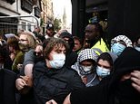 Protesters wearing keffiyehs link arms to try to block people from attending Tommy Robinson’s visit to Oxford Union – as pubs board windows and close early amid warnings of ‘unrest’