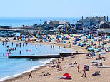 Thunderstorms batter heatwave Britain ahead of ‘hottest day ever’: Hosepipe ban announced with 40C furnace set to bring country to a standstill with rails buckled and schools and offices closed