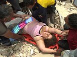 Moment woman is pulled alive from rubble in Venezuela earthquake disaster zone where thousands are still missing – as death toll climbs to 589