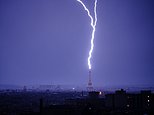 Moment lightning strikes Eiffel Tower as thunderstorms hit France following heatwave