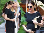 Anne Hathaway, 43, affectionately cradles her baby bump in NYC after unveiling surprise third pregnancy