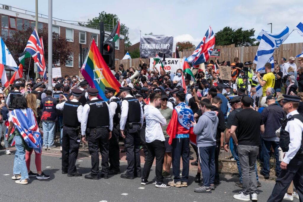 Protesters clash outside London synagogue staging Israeli property show as police make 14 arrests