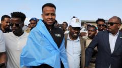 World Cup referee denied US entry arrives home to hero’s welcome in Somalia
