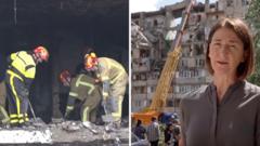 Russian attack leaves gaping hole in Kyiv residential building