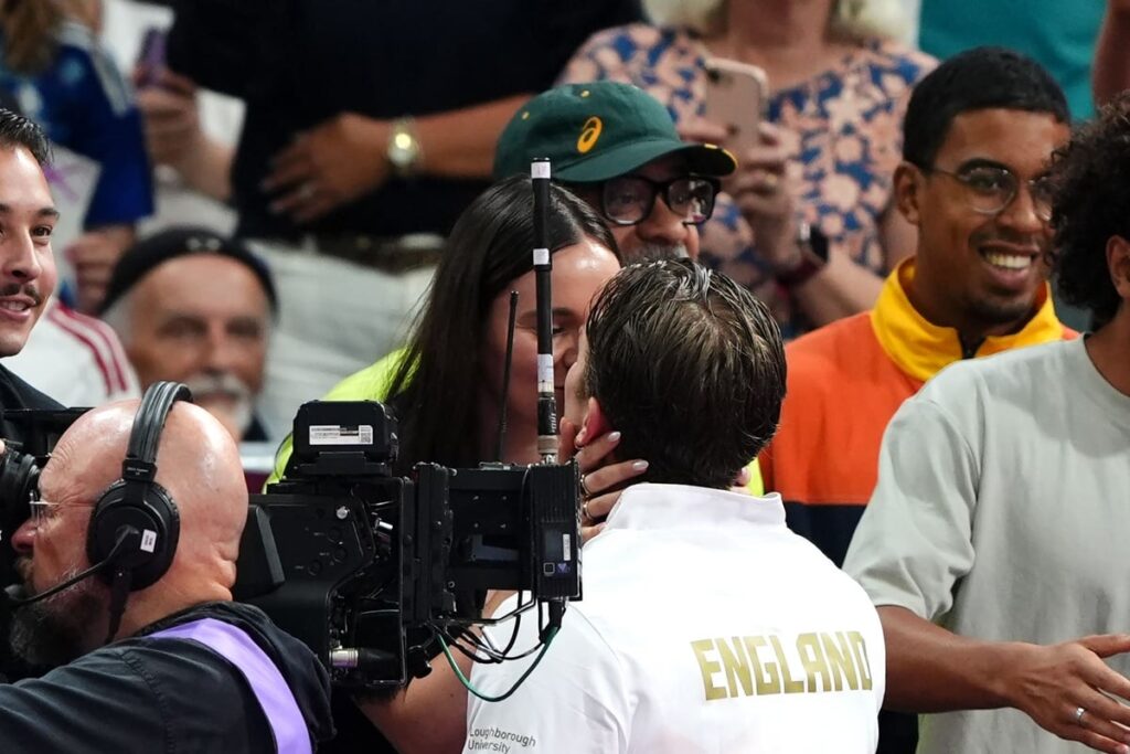 Swimmer Adam Ramsay-Peaty kisses pregnant wife Holly after winning bronze