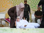 Inside Aceh’s brutal public canings where gleeful crowds watch men and women being whipped until they pass out under Sharia law punishment for sex outside marriage and gambling