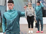 Phil Foden scratches his head after his exclusion from the England World Cup team as he goes on another shopping spree with girlfriend Rebecca Cooke
