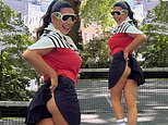 Kelly Brook flashes her peachy bottom as she recreates iconic tennis photo in tiny pleated skirt while playing a match