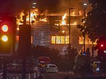 Dozens of firefighters are battling a massive blaze at a Jaguar and Land Rover service centre in London