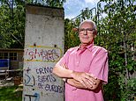 Neighbours at war in row over Berlin Wall: Property developer faces council probe after erecting section of the famous concrete structure in his garden without planning permission