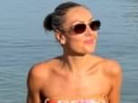 Amy Dowden, 35, poses in a bikini and reveals being put into an early, medically induced menopause alongside rounds of chemotherapy caused broken bones and muscle loss