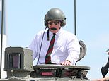Here comes His Majesty! King Charles driven around in army tank during visit to Dorset regiment…as Royal Family ‘shut out noise’ around Prince Harry’s visit