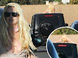 Britney Spears horrifies drivers as she CLIMBS OUT of car roof on busy freeway months after DUI arrest