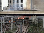 One of Britain’s busiest train stations is evacuated and National Rail lines plunged into chaos as huge fire breaks out next to tracks amid record-breaking heatwave
