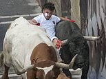 Pamplona bull runner is gored in the face and 12 others injured as thrill-seekers test their mettle in Spanish festival