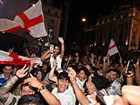 England fans spill out onto the streets after packing out pubs across the country to watch Jude Bellingham carry Three Lions into World Cup semi-final