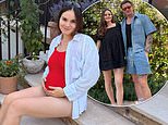Pregnant Holly Ramsay cradles her growing baby bump in a red swimsuit as she enjoys the heatwave with husband Adam Peaty amid new family fallout