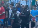 Now the Argentines are fighting EACH OTHER! Rival football fans clash on eve of ‘highest risk’ World Cup match with England