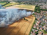 Moment hero farmers stop field blaze spreading to housing estate after braving flames in their tractors to plough emergency firebreak