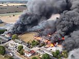 Twenty firefighters hospitalised after explosion sparked massive blaze that destroyed three fire engines at Essex industrial unit